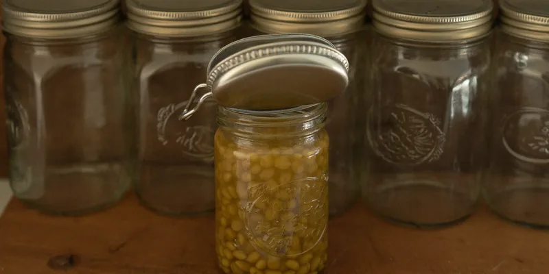 Suspect jar with domed lid set apart from sealed jars