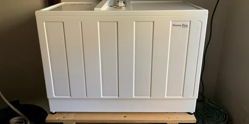 Large white freeze dryer on a bench in a pantry corner