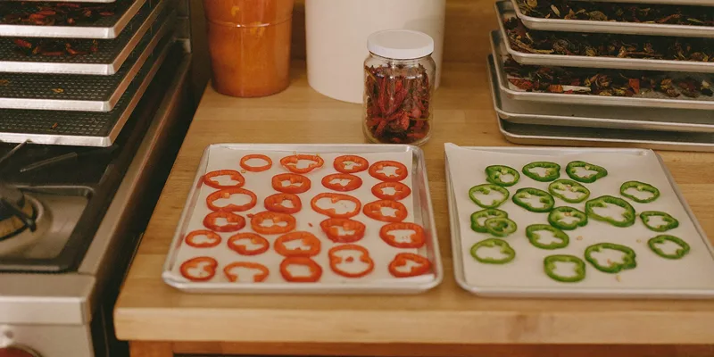 Red pepper and jalapeno rings on drying trays