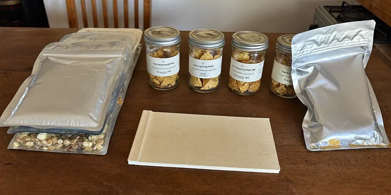 Silver pouches and jars of freeze dried food on a table
