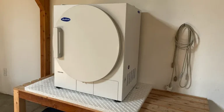 Freeze dryer on a bench in a tidy garage corner
