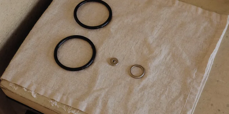 Spare gasket rings and small canner parts on a cloth