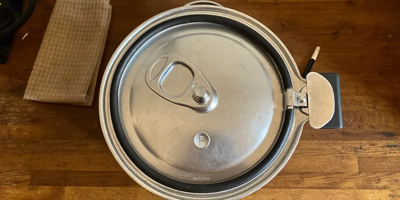 Pressure canner lid upside down showing its rubber gasket